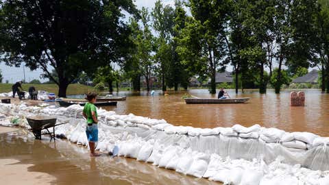 Payne Kuntz watches the high water in the Les Maisons Sur La Rouge subdivision. The Red River crested Monday, June 8, 2015, and likely will stay at or around its current level for the next few days before slowly decreasing, National Weather Service meteorologist Davyon Hill said. (Henrietta Wildsmith/The Shreveport Times via AP)