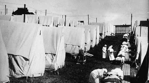 Nurses care for victims of a Spanish influenza epidemic in tents during an outdoor fresh air cure, Lawrence, Mass., ca. 1918. (Hulton Archive/Getty Images)