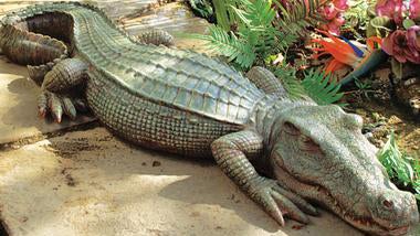 Maybe this "Swamp Beast" statue could ward off neighborhood dogs. (Image: Skymall.com)