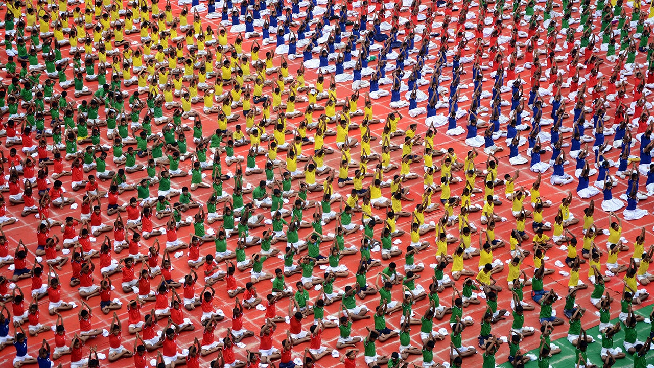 Indian schoolchildren take part in a yoga program in Chennai on June 19, 2015, ahead of International Yoga Day on June 21. Preparations in India have been gathering pace since the UN agreed to the day, with schools, military barracks and even jails encouraged to participate in their own sessions. (STRDEL/AFP/Getty Images)