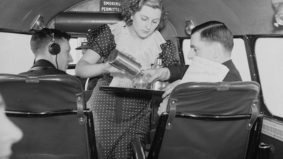 Circa 1936: Air hostess Daphne Kearley of Golders Green tending to the crew of the new luxury air service from Croydon, England to Paris, operated by Air Dispatch. (Ward/Getty Images)