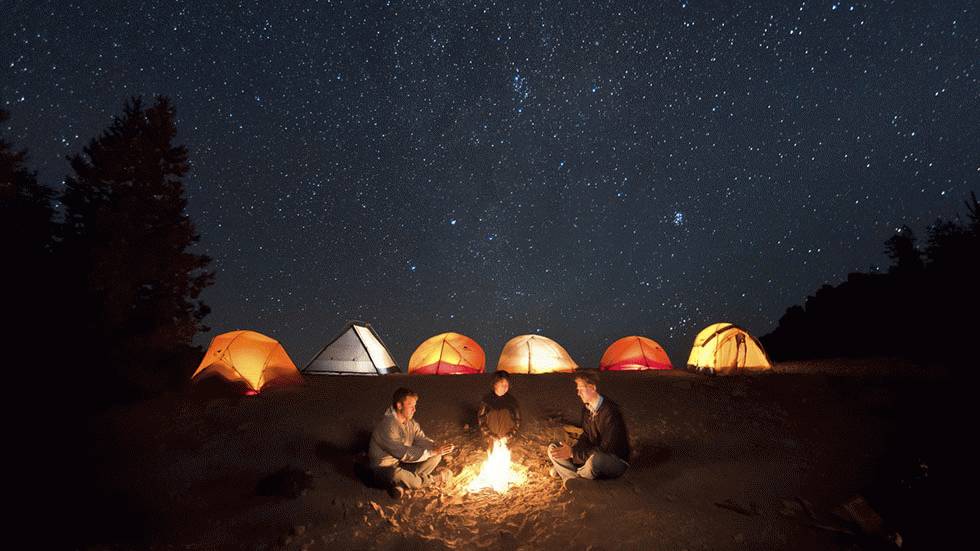 The Portland-based photographer captures the night sky above a campfire in the Cascade Mountains of Oregon. (Ben Canales)