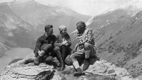 Mountaineers Dorothy Pilley, Count Rinkie Donnersmark of Germany, left, and Hans Russ of Norway sitting on top of a mountain, ca. 1930. (General Photographic Agency/Getty Images)