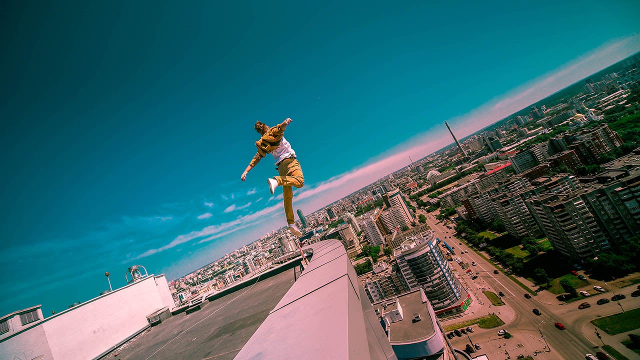 These stomach-churning images offer a unique perspective of the worlds cities - snapped high above the ground by a fearless roof-topper. While rooftopping images have become increasingly popular over recent years, pseudonymous Oleg Cricket adds distinctive - and extremely dangerous - elements to his sky-high shots. In some of scenes, Internet-star Oleg can been seen dangling from roofs, cranes and spires hundreds of feet above the ground. And in others, the daredevil-come-photographer is even snapped swinging his friend, Ilya Bagaev, high above the ground with nothing to break their fall.  (Oleg Cricket/Caters News)