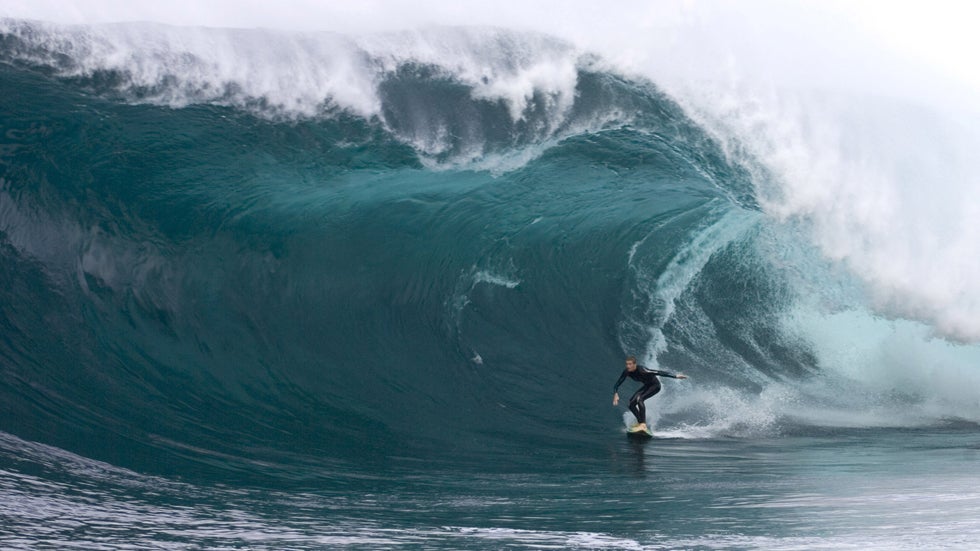 Surfer Laurie Towner surfs Shipsterns Bluff in Hobart, Tasmania, Australia, on March 11, 2006. Towner paddled into what some are calling the biggest wave ever to be ridden at Shipsterns Bluff. (Tim Jones/Billabong XXL via Getty Images)