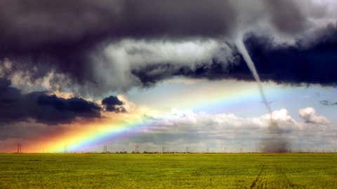 Jason Blum and his son captured these stunning photos of a tornado tearing through Colorado while in the midst of a rainbow. (Jason Blum/Caters News Agency))