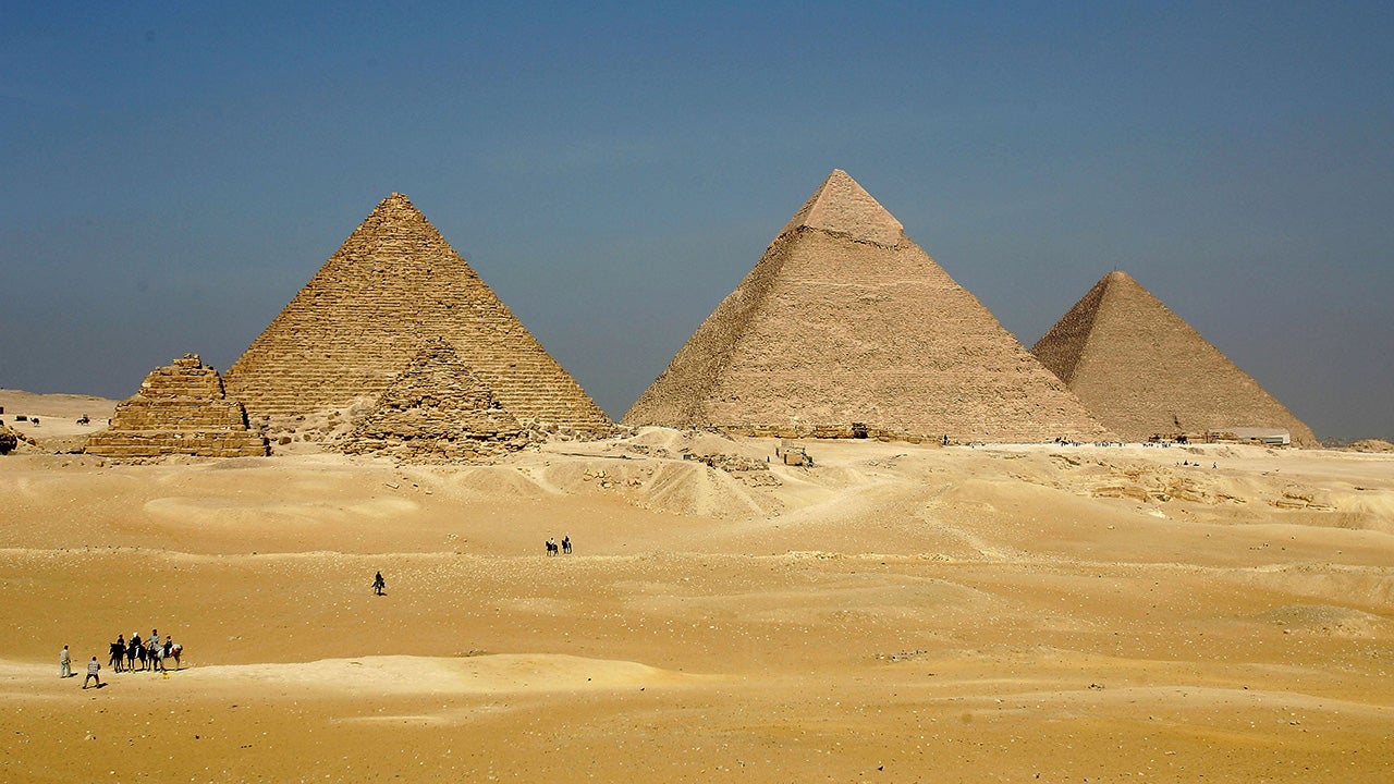Located south of Cairo in the desert, the three Pyramids of Giza, Menkaure, Khafre, and Khufu, are some of the most famous ancient sites in the world.  The three pyramids at Giza, built by King Khufu over a 30 year period around 2,550 B.C., The largest of the three - the Pyramid of Khufu - is the oldest of the Seven Wonders of the Ancient World. Today, these pyramids are among Egypt's biggest tourist attractions.  (Sean Gallup/Getty Images)