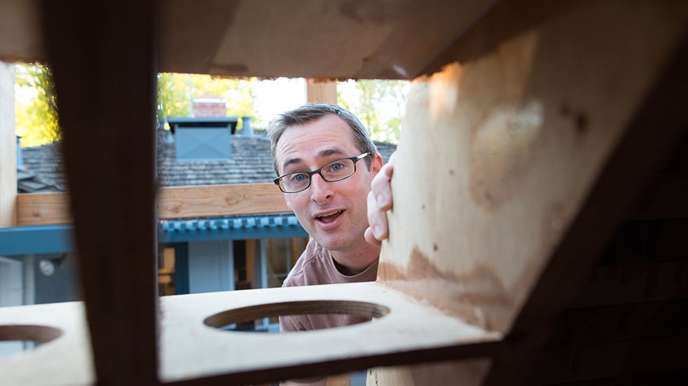 Chris Robinson works on the tsunamiball in his backyard. (Image: Chris Robinson/Tsunamiball.com)
