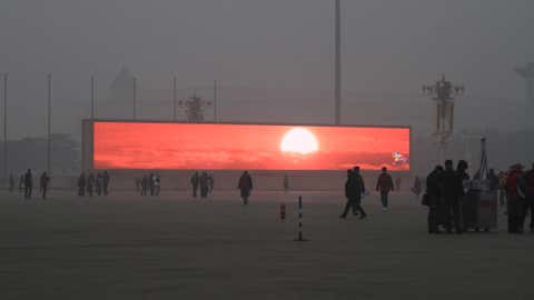 A haze of pollution surrounds a giant LED screen in Beijing's Tiananmen Square January 16, 2014. (ChinaFotoPress/ChinaFotoPress via Getty Images)