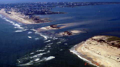 Hurricane Isabel cut this breach through Hatteras Island near the town of Hatteras,N.C.,as viewed by a USGS aircraft on Sept. 21,2003. (Image credit:USGS)