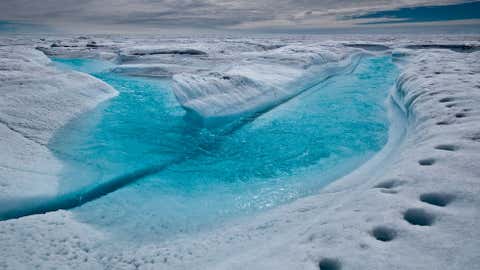 This series of photos, taken on an expedition to Greenland's North and South lake sites by a team from the University of Washington and the Woods Hole Oceanographic Institution in July 2010, give an up-close view of how quickly the island's ice sheet is melting. (Photo by Ian Joughin PSC/APL/UW)