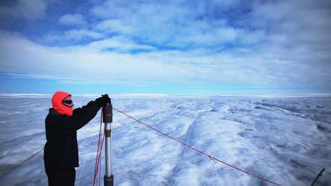 Tim Elam works on deploying the Ice Diver, which if successful will melt its way through the ice with electrical heating. (Joe Raedle/Getty Images)