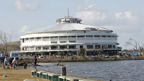 The Tacloban City Convention Center is being used as an evacuation center in the aftermath of Typhoon Haiyan on November 10, 2013 in Tacloban, Leyte, Philippines. (Image: Jeoffrey Maitem/Getty Images)