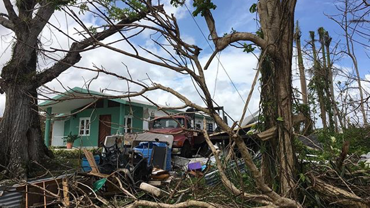 Debris remains outside a home in Comer&iacute;o, Puerto Rico, a month after Hurricane Maria. (Instagram/@tarasummers)