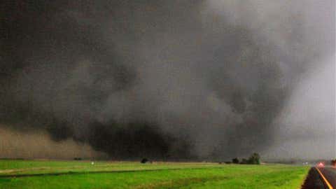 A tornado moves north in Canadian County after having just crossed SH-3, the Northwest Expressway, towards Piedmont, Okla. on May 24, 2011. (AP Photo/The Oklahoman, Paul Southerland)