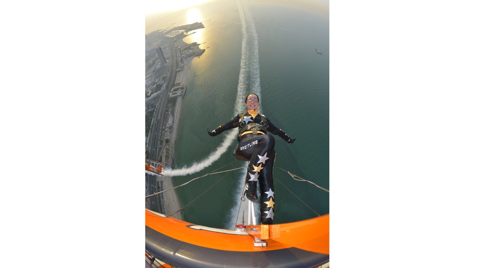 Breitling Wingwalker Danielle Hughes flies above Kuwait City's coastline with pilots David Barrell and Martyn Carrington on Thursday, March  6, 2014.  The team loop and roll up to 160 mph enduring G-forces of 4-5g. (Katsuhiko Tokunaga/Breitling via AP Images)