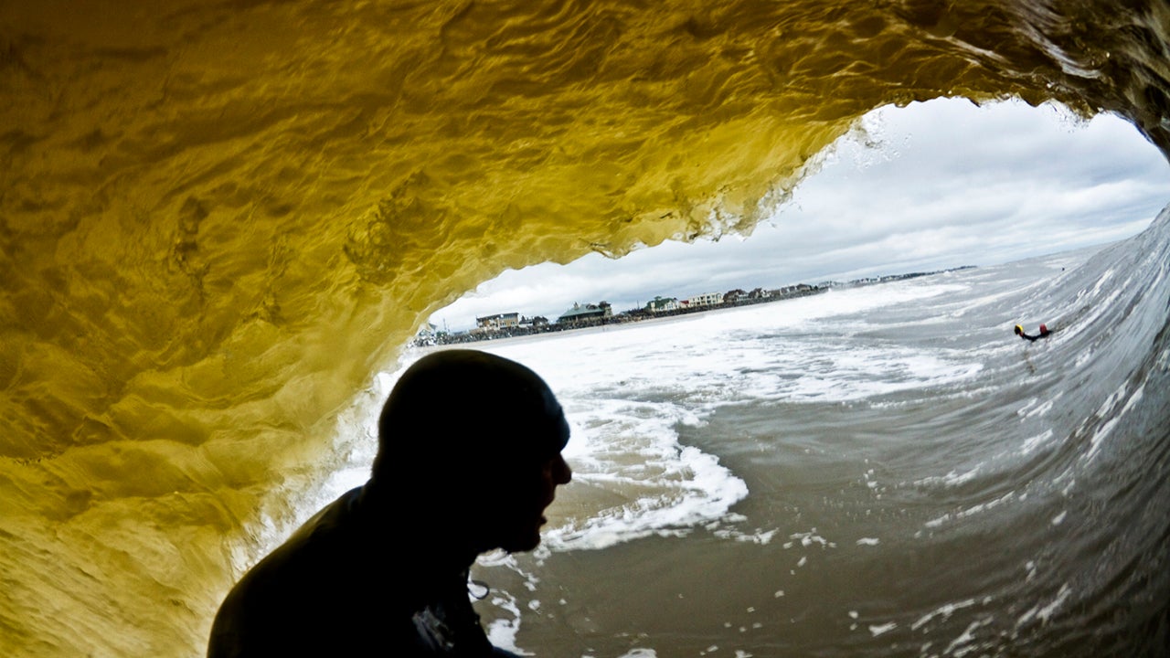 Swimming during a big South Swell event in Monmouth County can get pretty hairy. As I jumped back into the water and kicked as hard I could upstream, Sam Hammer dropped into this bomb. I followed him through the wave and got sucked over the falls. The pounding was worth it, I'm happy I came away with this image looking out of the tube. (Ryan Struck)