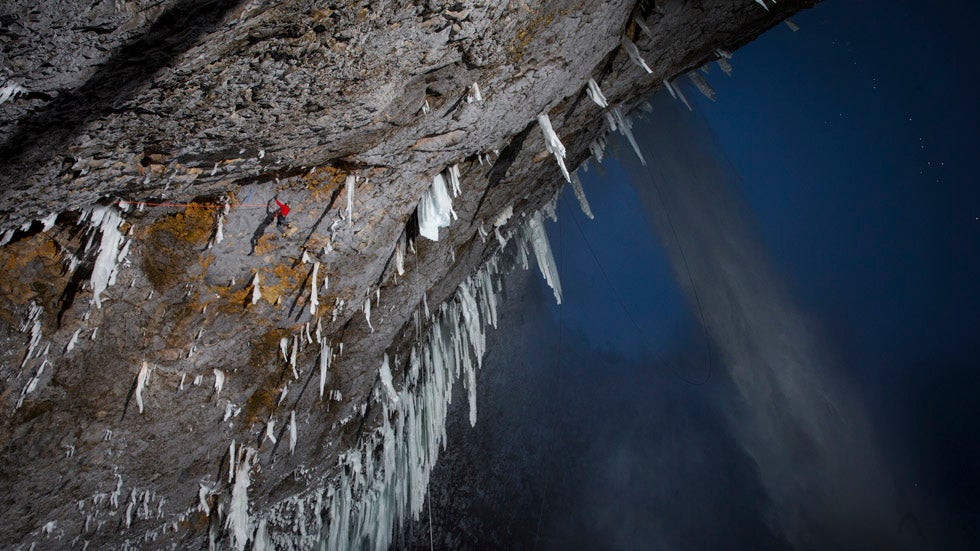 WIll Gadd performs while climbing a first ascent on a mixed route at Helmcken Falls in Wells Gray Provincial Park, BC, Canada on February 12, 2014. (Christian Pondella/Red Bull Content Pool)