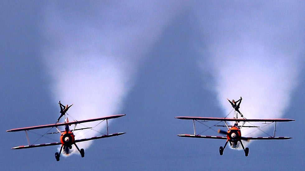 UK-based Breitling Wingwalkers display team performs over Kuwait City on March 8, 2014 during a promotional event to mark the opening of the first dedicated store of Breitling watches in Kuwait.  (YASSER AL-ZAYYAT/AFP/Getty Images)