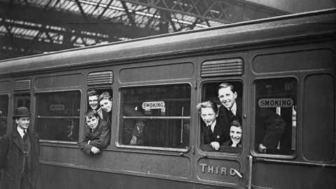 A group of orphaned boys from the Dr. Barnardo's Homes leave Waterloo Station in London for a new life in Canada, April 1923. (Topical Press Agency/Hulton Archive/Getty Images)