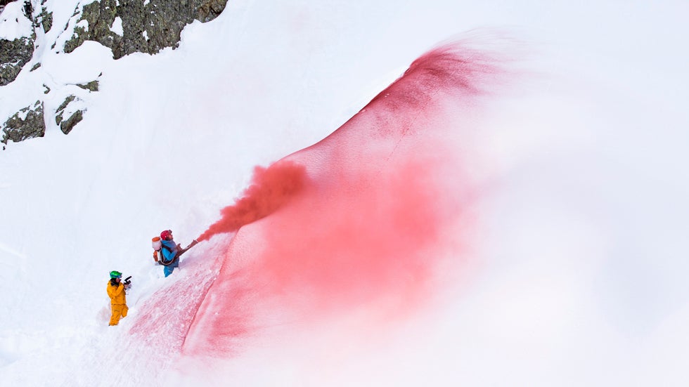 Mammut pro freeriders Nicolas and Loris Falquet and photographer Jeremy Bernard create colored snow with an atomizer in Les Marecottes in the Swiss Alps. (Jeremy Bernard and Mammut)