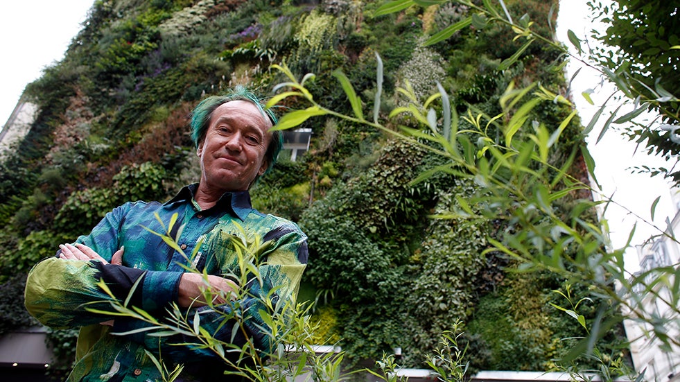 Patrick Blanc stands in front of his latest project in Paris in September 2013. (Courtesy: Thomas Samson/AFP/Getty Images)