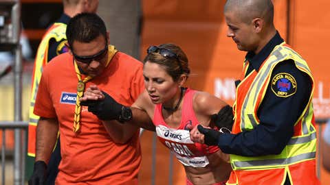 ASICS Elite Athlete Sara Hall is assisted by first aid after finishing the 2015 ASICS LA Marathon on March 15, 2015 in Los Angeles, California. (Jonathan Moore/Getty Images)