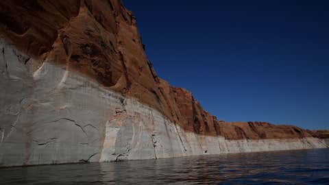 A tall bleached ''bathtub ring'' is visible on the rocky banks of Lake Powell on March 29, 2015 in Page, Arizona. (Justin Sullivan/Getty Images)