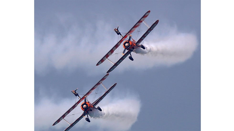 UK-based Breitling Wingwalkers display team performs over Kuwait City on March 8, 2014 during a promotional event to mark the opening of the first dedicated store of Breitling watches in Kuwait.  (YASSER AL-ZAYYAT/AFP/Getty Images)