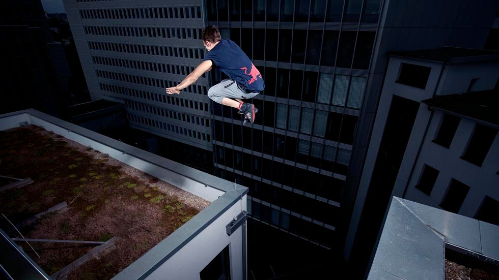 Freerunner Jason Paul performs on a rooftop during the Red Bull Wings Academy in Frankfurt, Germany on August 8, 2013. (Paul Ripke/Red Bull Content Pool)