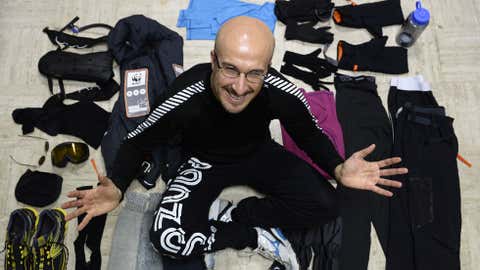 Malek Boukerchi poses with his equipment in Montsoult, north of Paris, on Nov. 7, 2013, where he has been training in a refrigerated storage unit for the Antarctic Ice Marathon to take place in Antarctica on Nov. 20, 2013. (FRANCK FIFE/AFP/Getty Images)