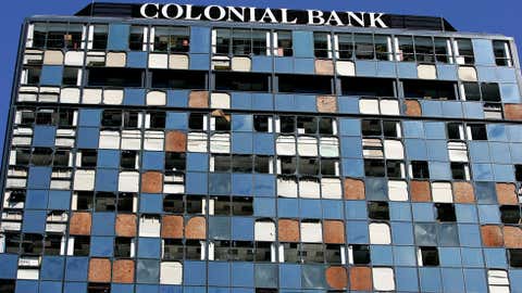 The Colonial Bank building, damaged by Hurricane Wilma, stands October 26, 2005 in Miami, Florida. (Photo by Carlo Allegri/Getty Images)