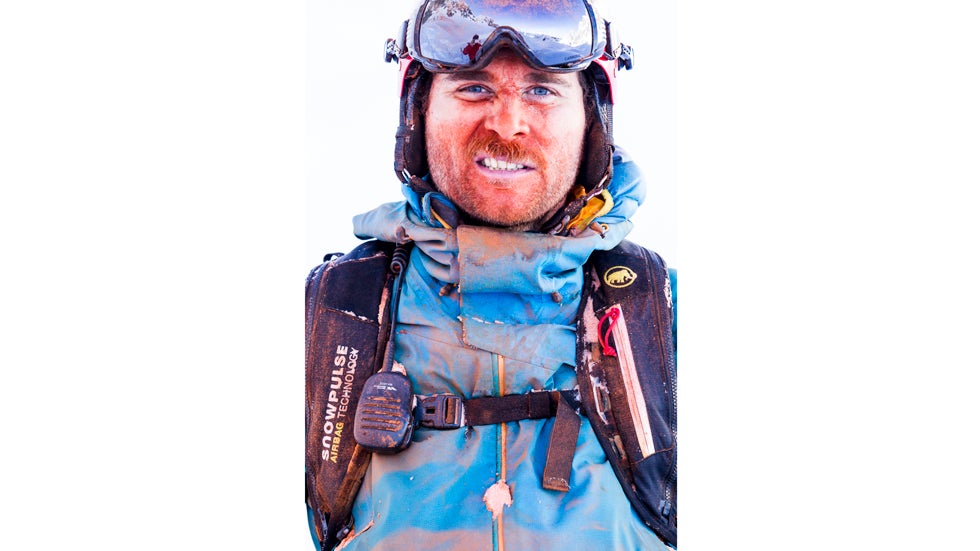 Mammut pro freerider Nicolas Falquet is covered in colored snow after skiing the slopes of Les Marecottes, Switzerland. (Jeremy Bernard and Mammut)