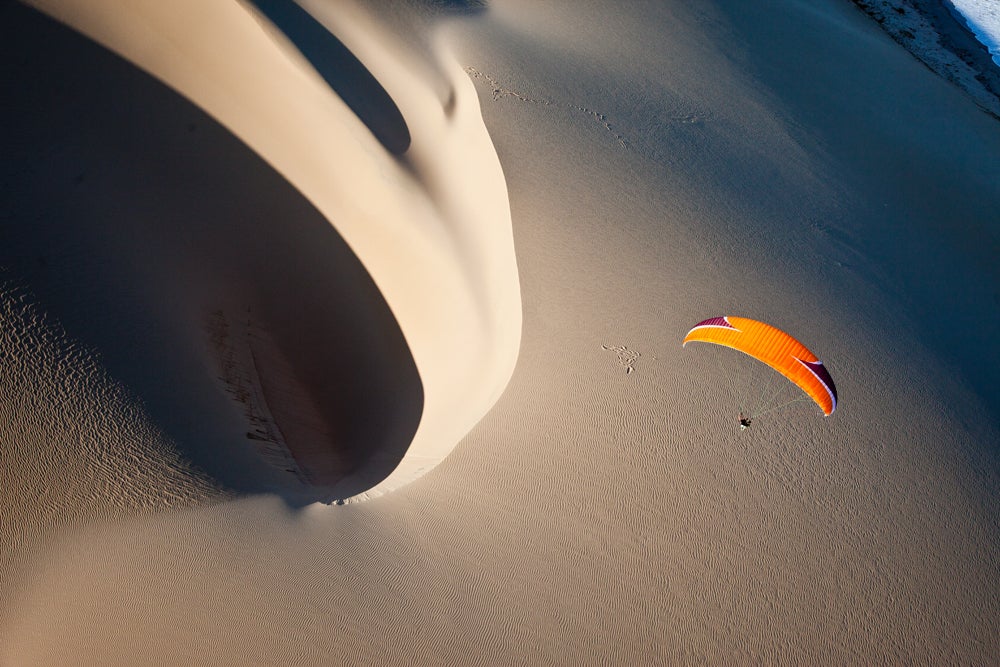 MacDonald says the wind direction was perfect for paragliding this sand dune in Mozambique. (Image: Jody MacDonald)