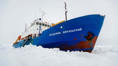 The Russian ship MV Akademik Shokalskiy is trapped in thick Antarctic ice 1,500 nautical miles south of Hobart, Australia, Friday, Dec. 27, 2013. (AP Photo/Australasian Antarctic Expedition/Footloose Fotography, Andrew Peacock)