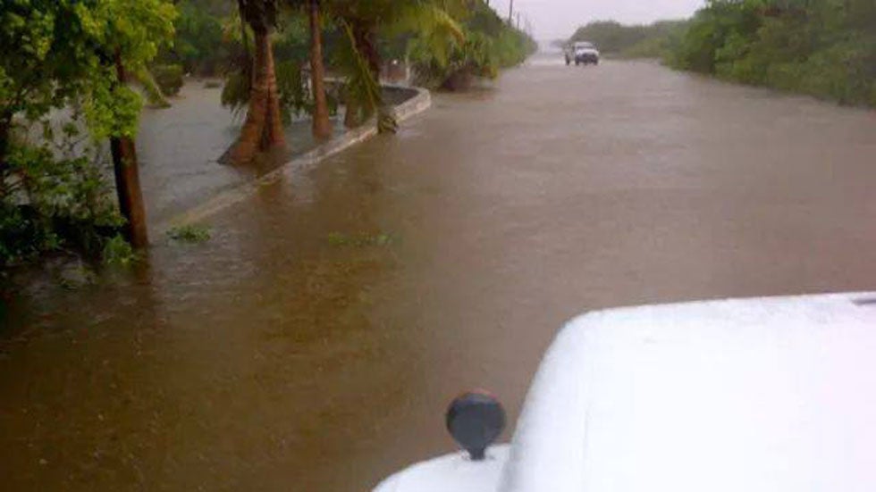 A street is flooded by the effects of Tropical Storm Cristobal, Sunday, Aug. 24, 2014. (Facebook/Shyonne Francis)