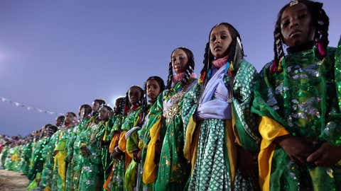 Girls from a nomadic Tuareg tribe dressed in traditional clothes attend the 16th International Ghat Festival, in the ancient city of Ghat in the heart of the southwestern Libyan desert on February 15, 2010. (MAHMUD TURKIA/AFP/Getty Images)