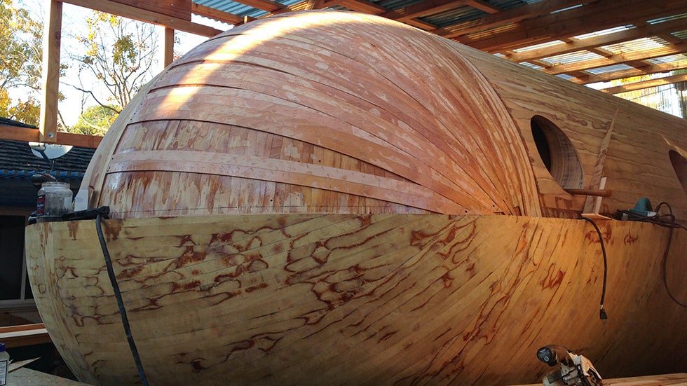 The shell of the boat, complete with a few layers of stripping, sits in Robinson's backyard in early 2014. (Image: Chris Robinson/Tsunamiball.com)