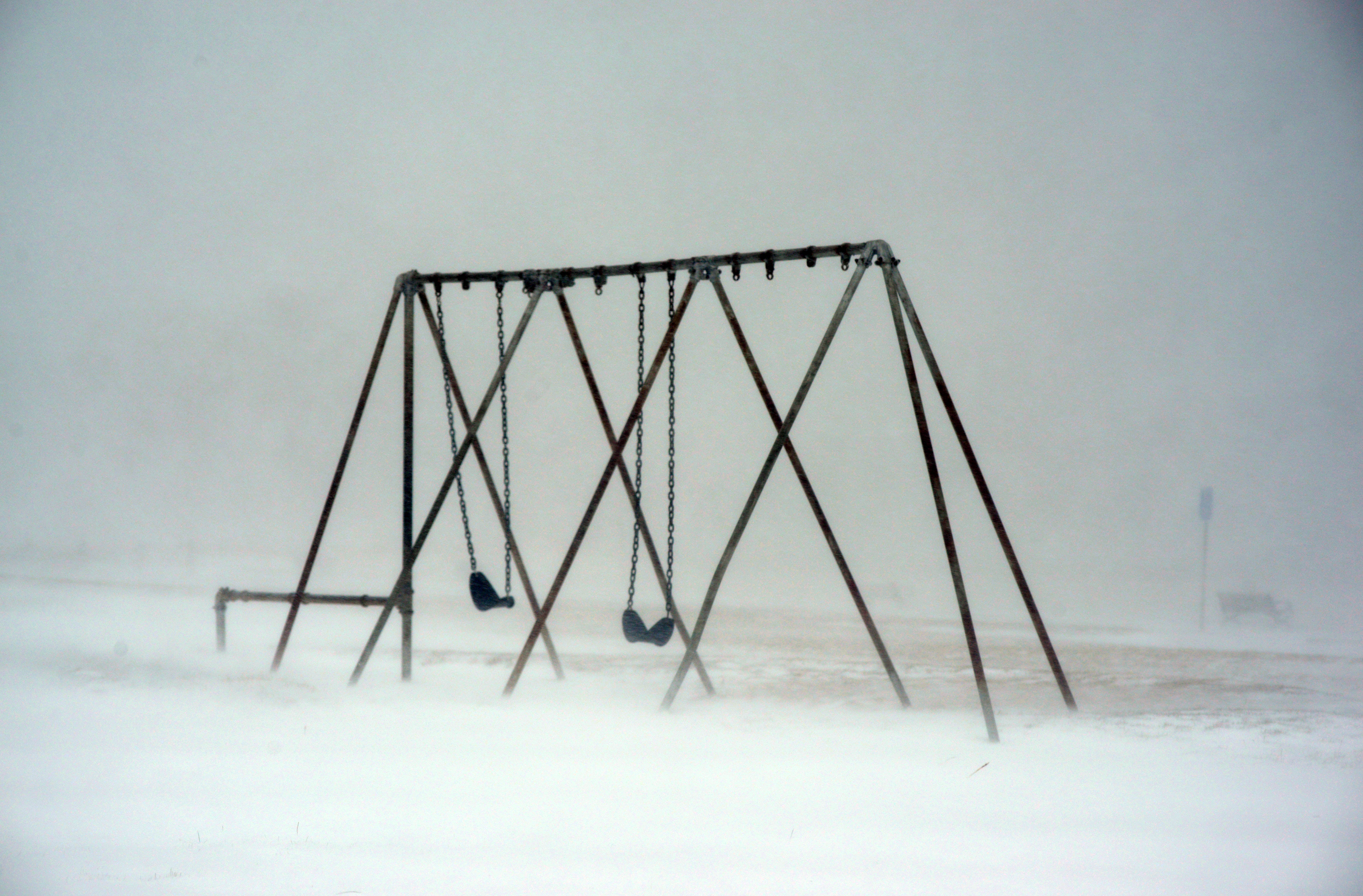 A swing set is seen at Veterans Park Beach during a snowstorm March 26, 2014 in Hyannis, Mass. Darren McCollester/Getty Images)