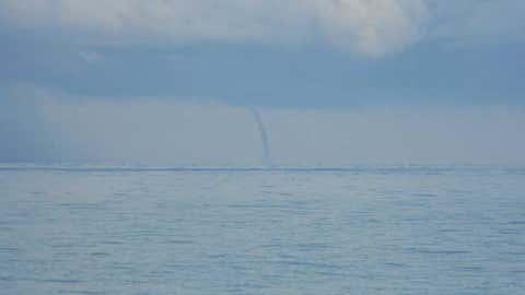 Waterspout 5-10 miles off of Milwaukee, Wisc. near Bradford Beach. (iWitness weather user: Brock Burghardt)