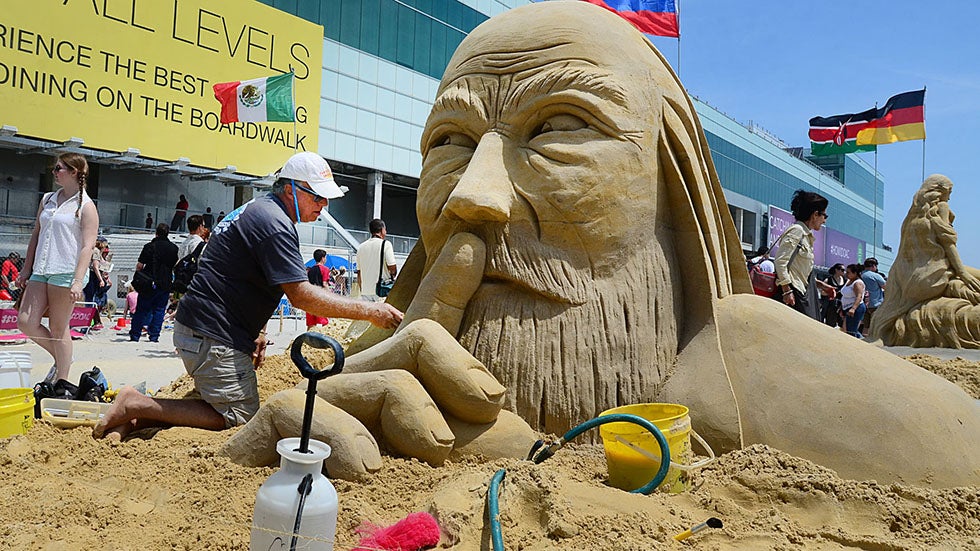 Sculptor Matt Long of Staten Island New York, an original cast member of the Travel Channel TV show, 'Sand Masters,' works on his entry, Sunday, June 16, 2013, during the World Championship of Sand Sculpting on the beach next to the Pier at Caesars in Atlantic City, N.J. (AP Photo/The Press of Atlantic City, Ben Fogletto)
