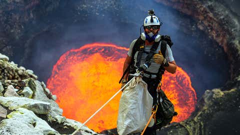 Nik Halik abseils down into Marum, an active lava lake of Ambrym, Vanuatu.