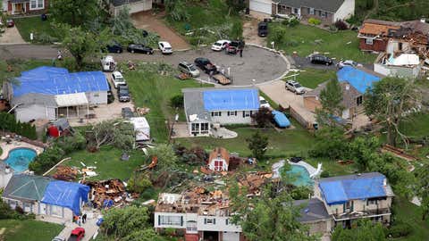 Homes along Pralle Lane and Mary Pat Court were damaged in the storm, Saturday, June 1, 2013 in St. Charles County, Mo. (AP Photo/St. Louis Post-Dispatch, Robert Cohen)