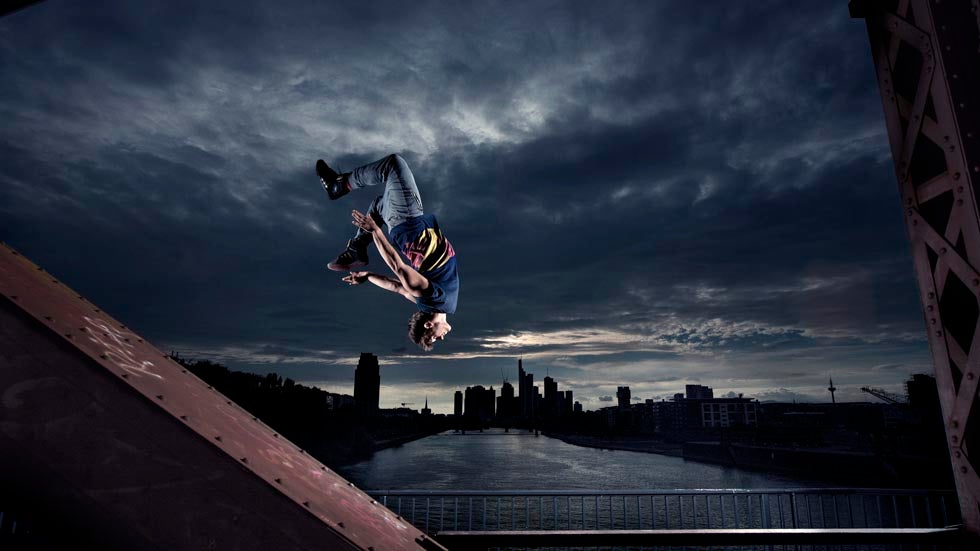 Freerunner Jason Paul performs on a bridge during the Red Bull Wings Academy in Frankfurt, Germany on August 8, 2013. (Paul Ripke/Red Bull Content Pool)