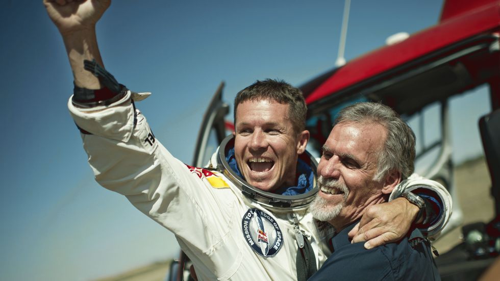 In this photo provided by Red Bull Stratos, pilot Felix Baumgartner of Austria and Technical Project Director Art Thompson, celebrate after successfully completing the final manned flight for Red Bull Stratos in Roswell, N.M., Sunday, October 14, 2012.