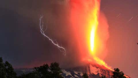 The Villarrica volcano erupts near Pucon, Chile, early Tuesday, March 3, 2015. (AP Photo/Aton Chile)