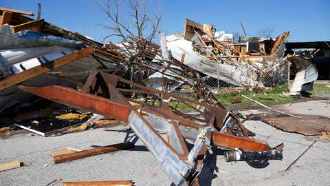 A mobile home frame is pictured between an overturned mobile home at left, and a tornado-damaged mobile home at right, in Sand Springs, Okla., Thursday, March 26, 2015. Gov. Mary Fallin declared a state of emergency for 25 Oklahoma counties that were hit hardest by the storm. (AP Photo/Sue Ogrocki)