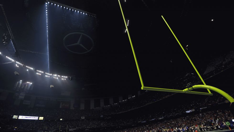 Half the lights are out in the Superdome during a power outage in the second half of the NFL Super Bowl XLVII football game between the San Francisco 49ers and Baltimore Ravens on Sunday, Feb. 3, 2013, in New Orleans. (AP Photo/Marcio Sanchez)