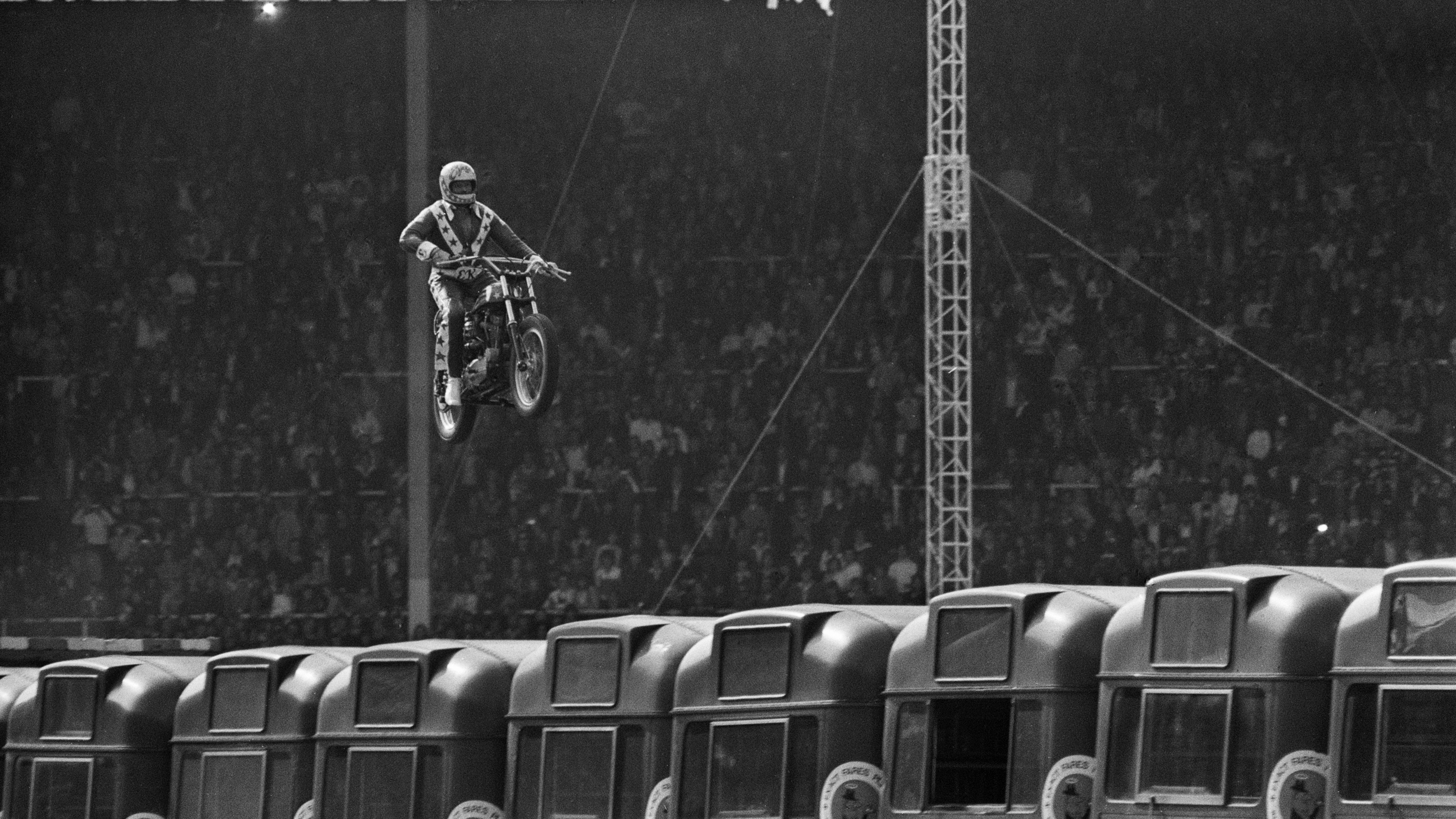Evel Knievel , perhaps the most well-known daredevil, attempting to jump 13 buses at Wembley Stadium, London, on May 26, 1975. (Photo by David Ashdown/Keystone/Hulton Archive/Getty Images)