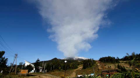 Plumes of smoke and ash billow from Mount Ontake as it continues to erupt for the third day in Otaki village, in Nagano prefecture, Japan, Monday, Sept. 29, 2014. (AP Photo/Koji Ueda)